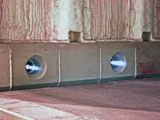 Furnace burner ports firing